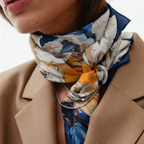 Mlle Ceinté Paris silk scarf, central orange vortex with flying marble angel figures, blue and orange fluid background, baroque style, 90x90 cm.