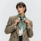 Mlle Ceinté Paris silk scarf, jumping horse with floral pattern coat, navy blue saddle and orange trim, sage green grid background.