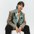 Mlle Ceinté Paris silk scarf, jumping horse with floral pattern coat, navy blue saddle and orange trim, sage green grid background.