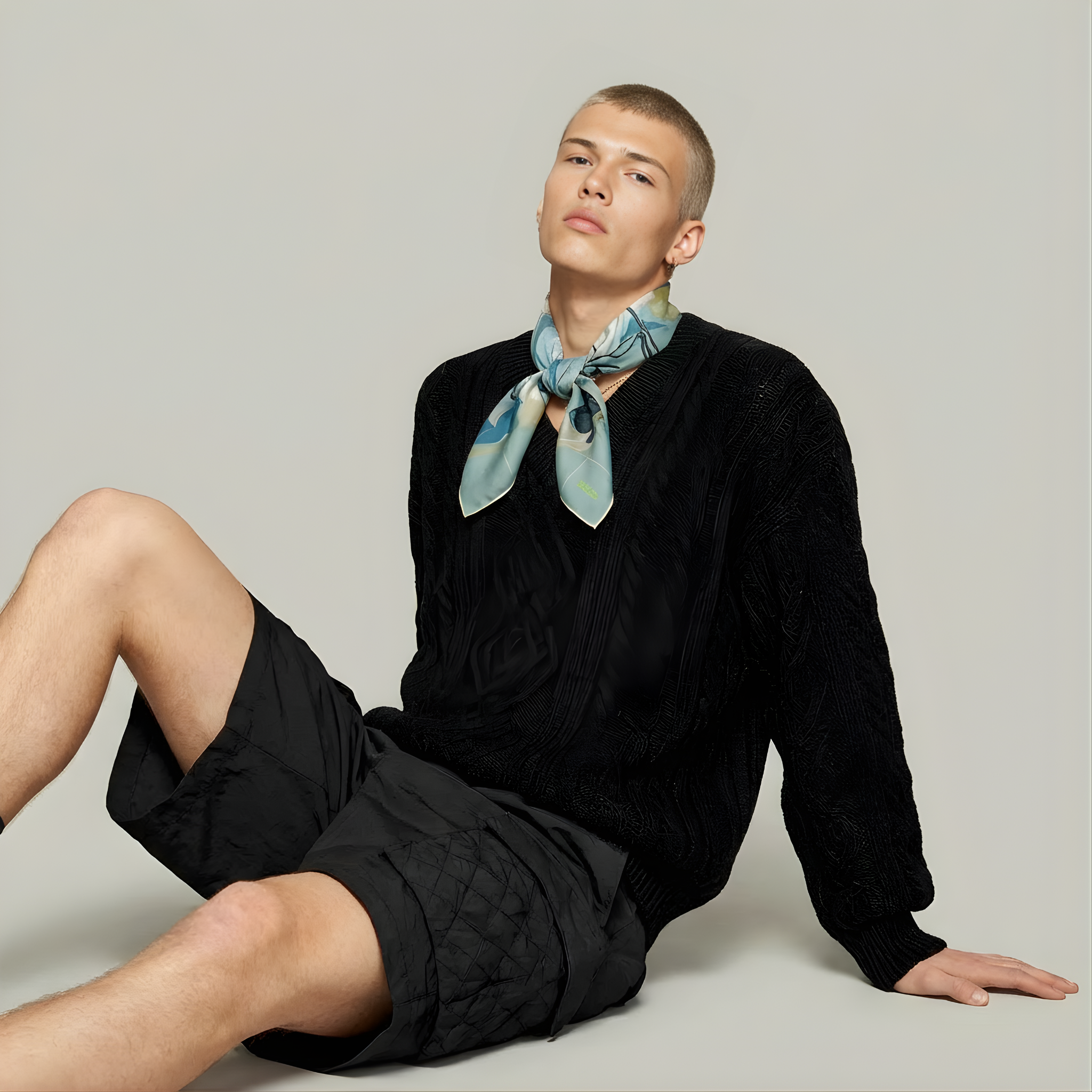 Mlle Ceinté Paris silk scarf, jumping horse with floral pattern coat, navy blue saddle and orange trim, sage green grid background.