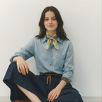 Mlle Ceinté Paris silk scarf, large coral and white striped ribbon bow, riding helmet, vintage tennis racket and fencing sword on teal background.