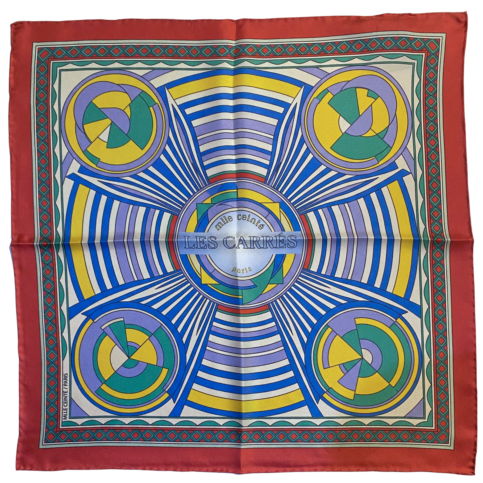 Mlle Ceinté Paris ipek eşarp, merkezden yayılan hipnotik çizgiler, sarı mavi ve yeşil geometrik daireler, kalın kırmızı bordürlü lüks şal. Mlle Ceinté Paris silk scarf, bold red border, hypnotic radiating lines with yellow, blue and green geometric circles, luxury square.