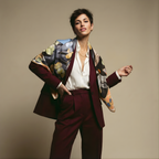 Mlle Ceinté Paris silk scarf, sleeping dark skinned figure, bunch of green grapes, peach checkered tablecloth, blue sky background surreal art.