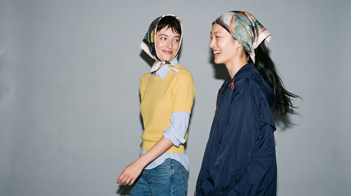 Two models wearing The Heritage Carriage and The Noble Steed silk carrés.